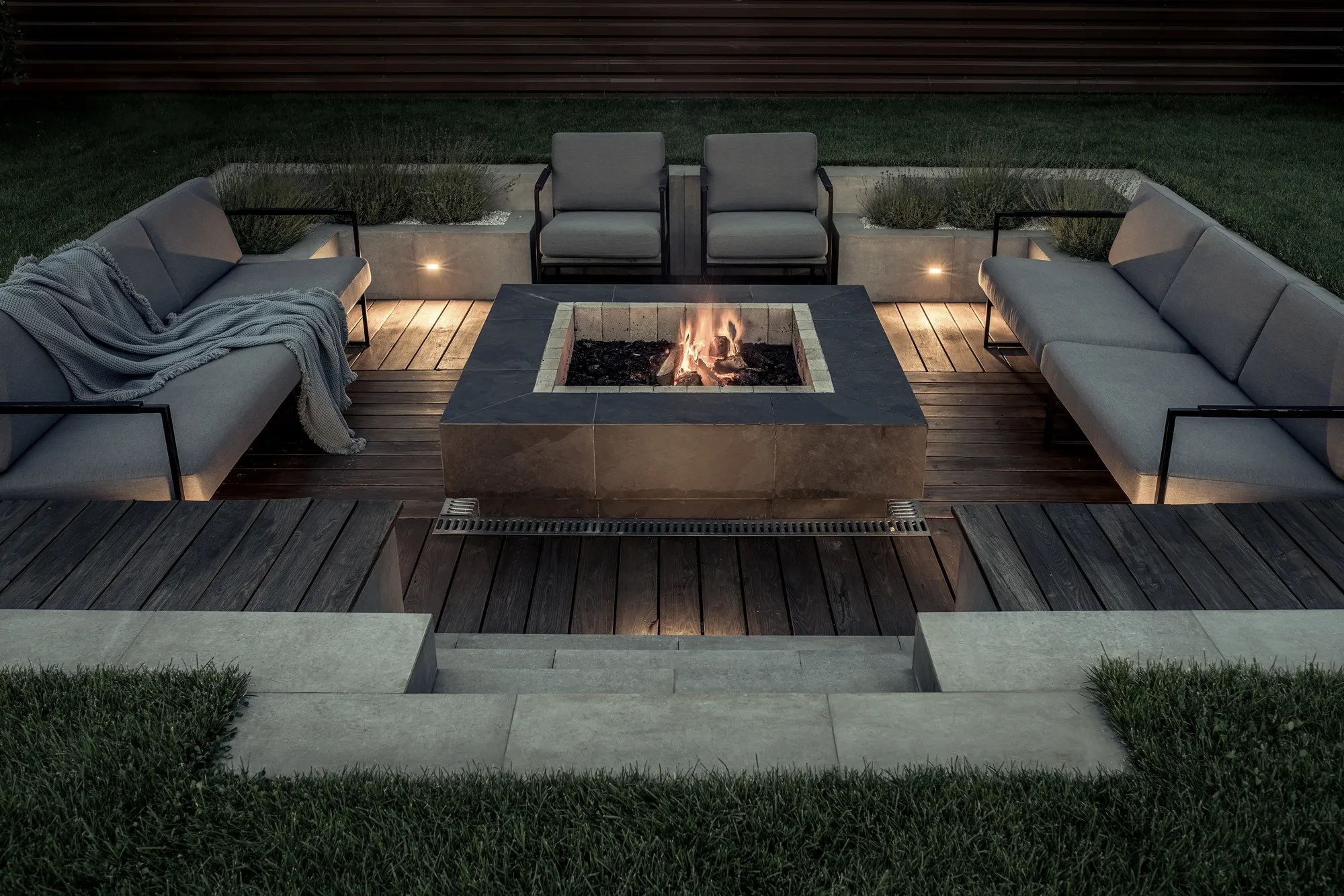 Outdoor fireplace built into a patio seating area