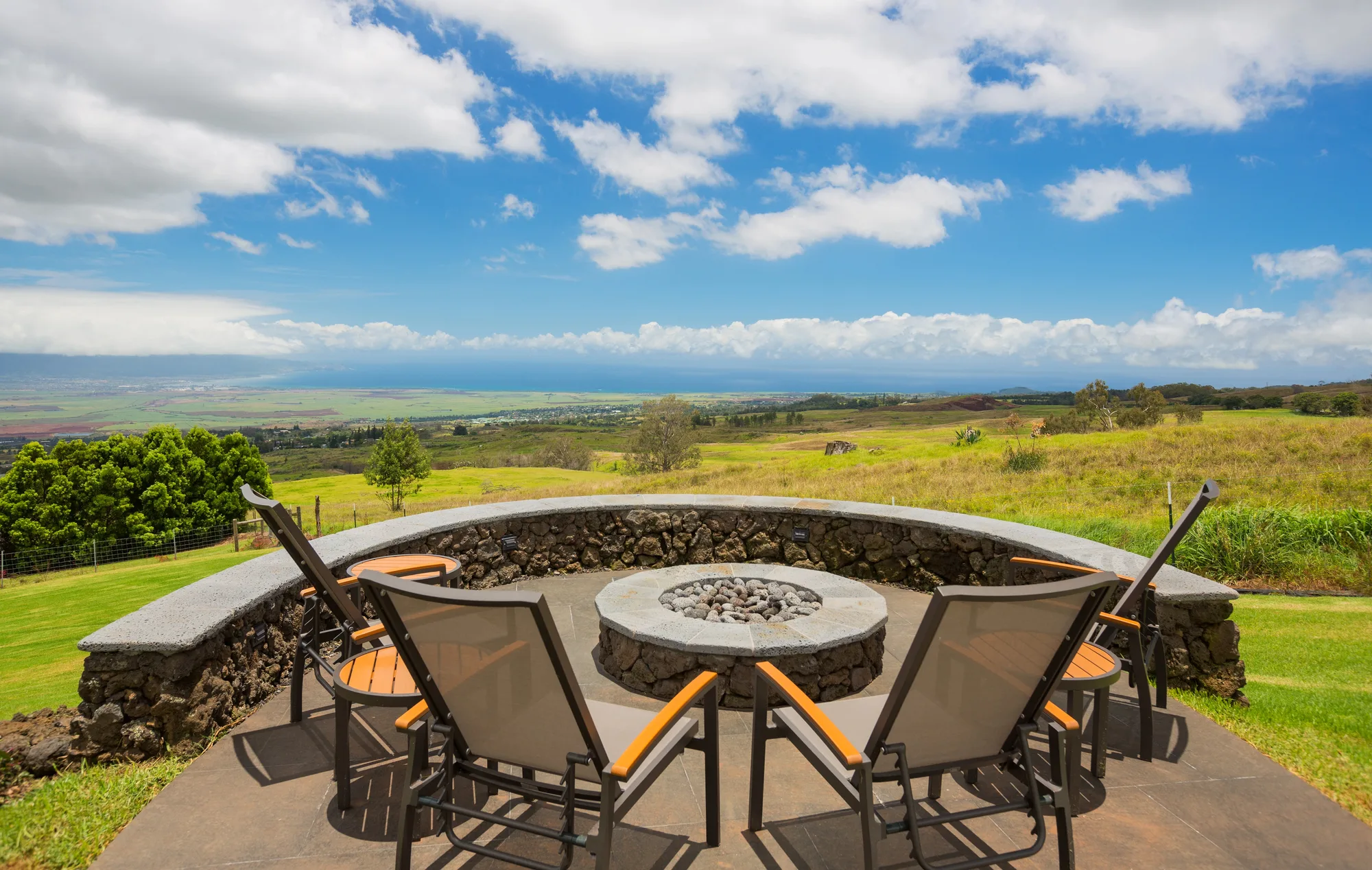 Outdoor fire pit area with seating at dusk
