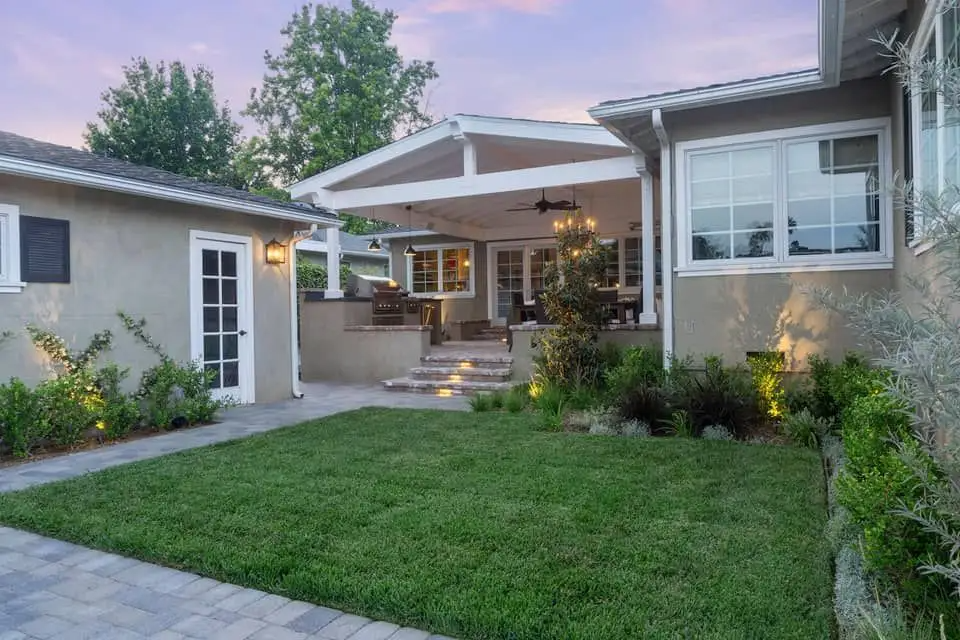Leafy backyard garden with established trees and lawn